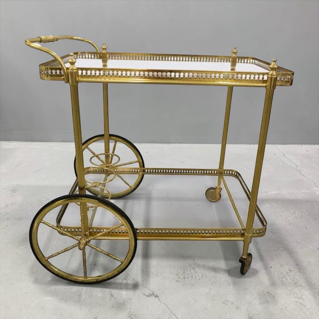 This very nice neoclassical style bar cart is made of silvered brass. Message for more details or delivery!