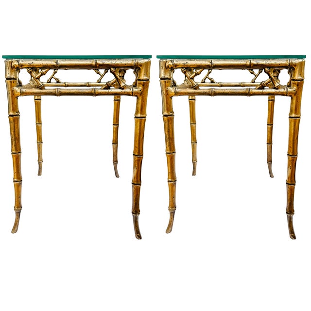 A striking pair of vintage Hollywood Regency side tables attributed to Phyllis Morris. Designed with a sophisticated...