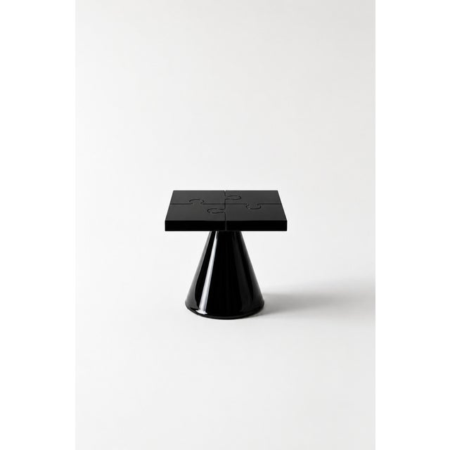 Popzlle turns a side table into a small piece of wit: its square top is cut into four interlocking puzzle pieces, finished...