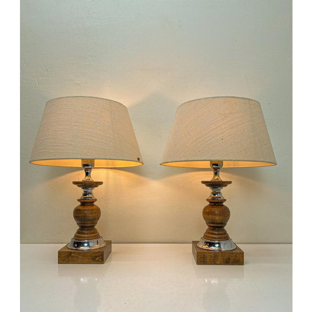 A set of 2 Spanish Table Lamps from the 1960s. This set in the Spanish Revival or Spanish Gothic style is made of oak with...