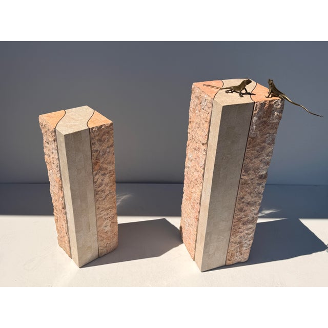 Pair of tessellated fossil coral and pink stone pedestals with brass trim. Larger pedestal is 12”x12”x 36” tall Smaller is...