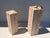 Pair of tessellated fossil coral and pink stone pedestals with brass trim. Larger pedestal is 12”x12”x 36” tall Smaller is...