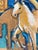 This original acrylic and charcoal work on paper depicts three horses emerging from an expressive, abstract landscape....