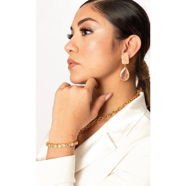 The Kathya Earrings are crafted from semi-precious stones, representing our top-selling design characterized by delicacy...