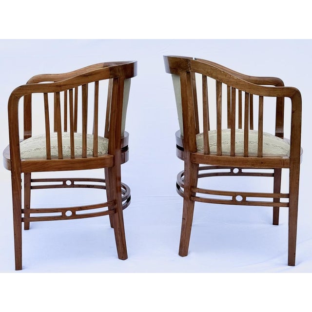 The armchairs exemplify early Viennese modern design, combining geometric clarity with refined craftsmanship typical of...