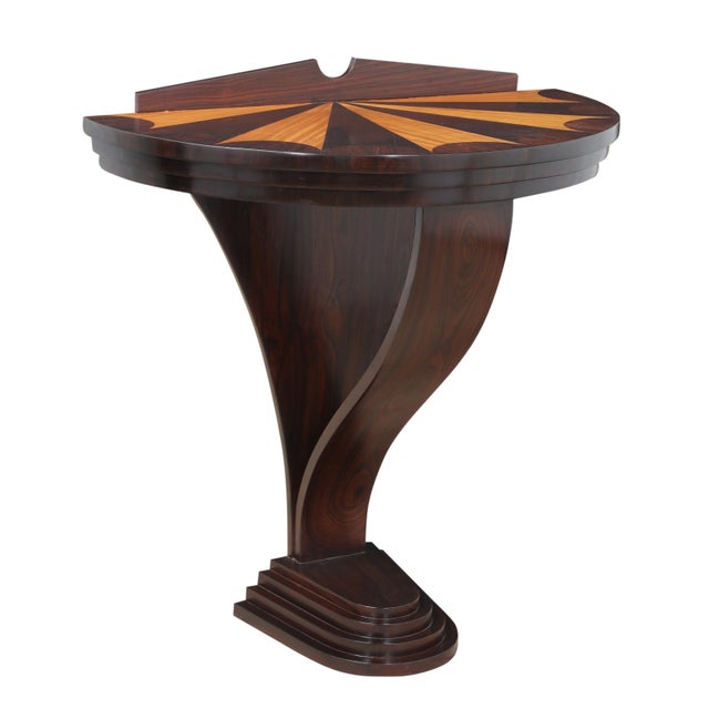An amazing Art Deco half-round demi-lune console table. It features an inlay sunray design using rosewood and teak. The...