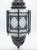 A handmade eight-sided lantern made from iron with an aged bronze finish and eight panels of gray frosted glass. The...