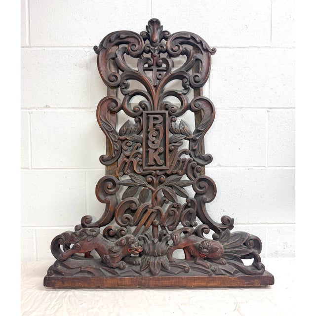 This large antique 19th century carved wood architectural salvage pediment sculpture is a stunning piece of history....