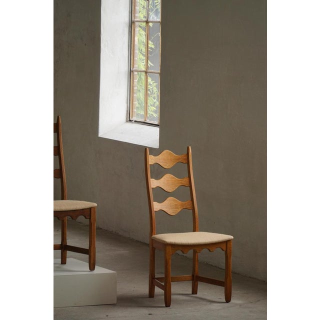 A beautiful set of six high-back dining chairs designed by Henning Kjærnulf and crafted in Denmark during the 1960s–1970s....