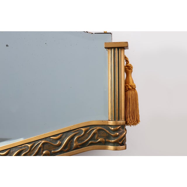 This Belgian Art Deco giltwood mirror from around 1920 is a striking example of early‑20th‑century decorative design,...
