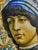 A large, hand-painted Italian platter featuring the portrait of a young man, based on a fresco from the workshop of Sandro...