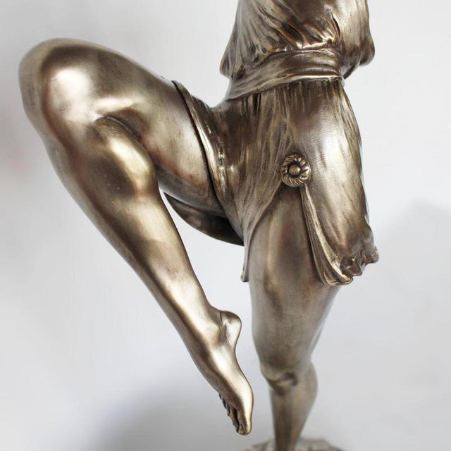Diana, an Art Deco silvered bronze sculpture depicting Diana the Huntress. Shown in stylised pose, holding a bow aloft....