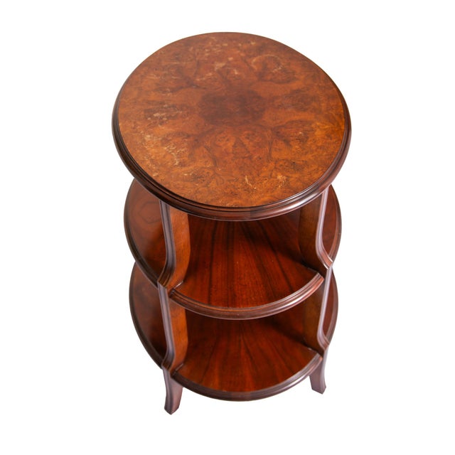 Baker Furniture regency three-tier accent table. A high end piece from Baker's Collector's Edition featuring a striking...