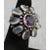 Silver cocktail ring with faceted Amethyst and moonstone settings. Cocktail ring with a deep amethyst center stone and...