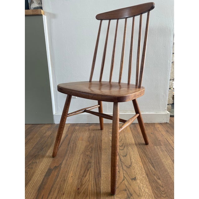 A vintage mid-century simple modern spindle side chair with a solid construction. Made by Liko in Yugoslavia. This chair...