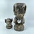 This carved wooden monkey-shaped vessel originates from the Baule people of West Africa. The container is surmounted by a...