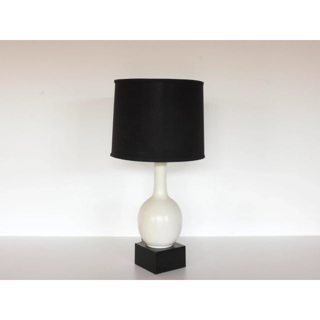 1960s Midcentury European craquelure / crackle white pottery table lamp on black block square base, with black lamp shade....