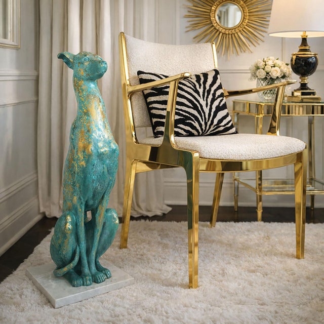 Offering a large seated Italian ceramic greyhound sculpture mounted on a white marble base, signed on bottom, made in...