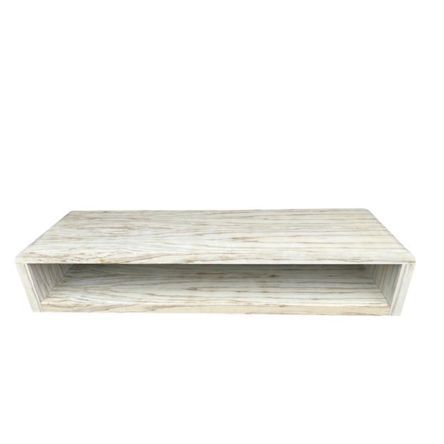 This striking vintage waterfall coffee table showcases the natural beauty of Black Limba veneer, known for its soft creamy...