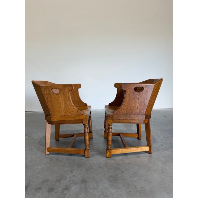 Pair of Vintage Dutch Colonial Style Barrel Back Armchairs. Paneled backs wrap around sides with heart shaped hand hold...