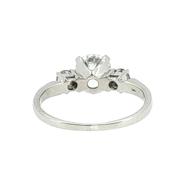 Late 20th-century 3-diamond engagement ring. The ring features a 1.18-carat Ideal brilliant-cut white diamond with F color...
