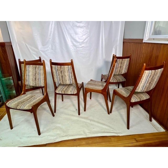This is a fantastic set of mid-century modern chairs crafted from beautiful teak wood. Their striking shape and design...