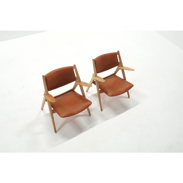Vintage CH28 Sawbuck Lounge Chairs by Hans J. Wegner for Carl Hansen, 1960s, Set of 2, in Very Good conditions. Designed...