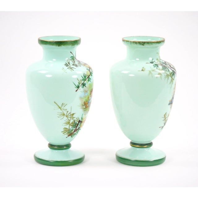 Transport yourself to the early 20th century with these exquisite French hand-painted art glass decorative vases. Adorned...