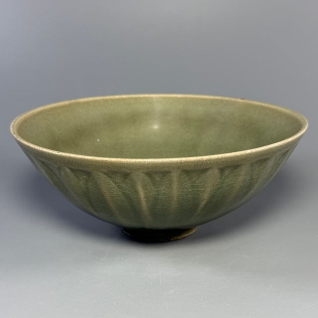 Beautiful antique Chinese Longquan celadon bowl with carved lotus petal patterns on exterior. Elegant shape, smooth...