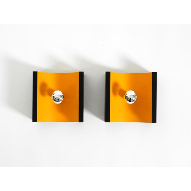 Two rare, original 1960s Space Age metal wall lamps. Designed by Klaus Hempel for Kaiser Leuchten. Made in Germany....