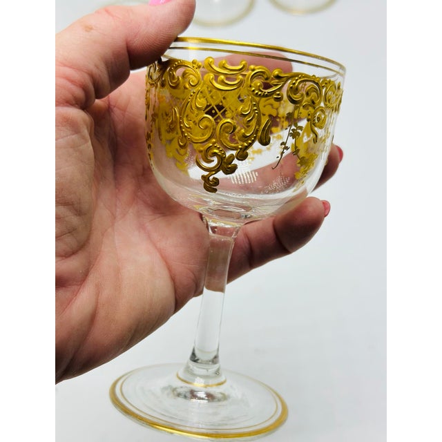 This elegant set of four vintage stemmed glasses features exquisite raised gilt decoration in an ornate Baroque-inspired...