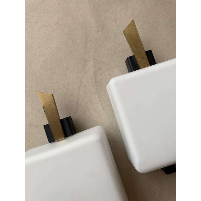 These wall lamps by Maison Arlus are among the most recognizable examples of French design from the late 1950s and early...