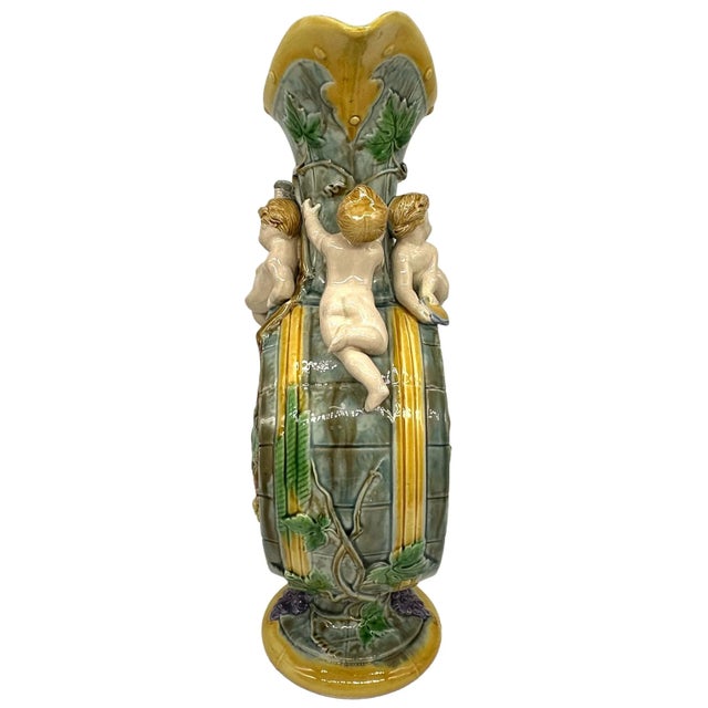 A Minton Majolica Wine Ewer Designed by Hugues Protât (active 1835-90), English, ca. 1875, the body molded as a wine...