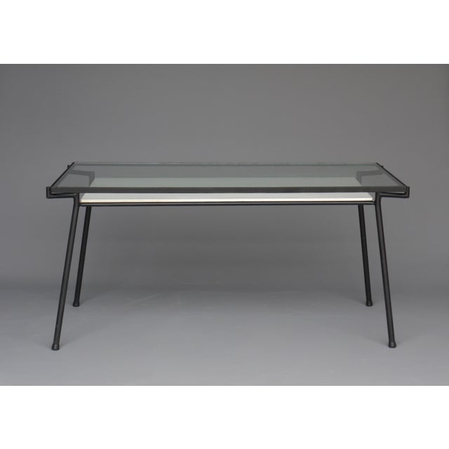 A rare table with under shelf that can also function as a desk. It was designed for the Dutch retailer Metz & Co circa...