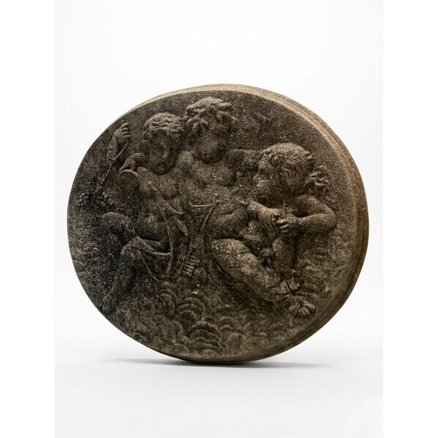 This charming vintage oval wall plaque, crafted from durable cast stone, features a high-relief Neoclassical scene of...