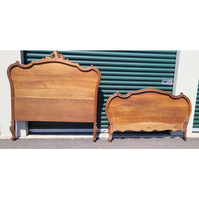 Fine Antique carved Rococo Style French headboard and footboard. Features a tall carved headboard and carved footboard,...