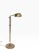 Adjustable brass pharmacy style floor lamp, with shell form shade. The lamp features a vertical center post allowing the...