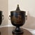 A gorgeous vintage Mid-20th Century Italian black and gold tole lidded urn style ice bucket with a bakelite interior...