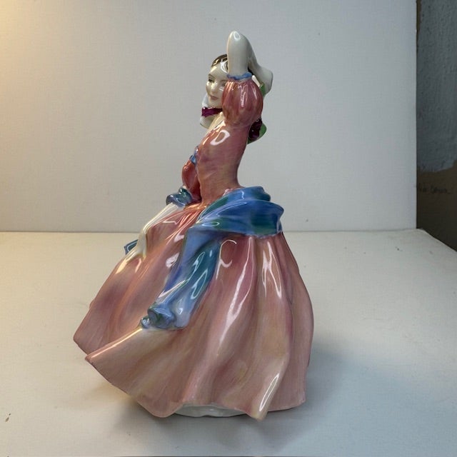 This vintage Royal Doulton “May Time” figurine (HN2113) is a classic example of mid-century English bone china artistry....