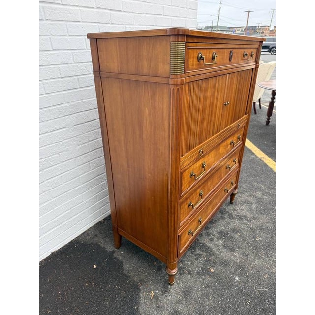 Kindel Louis XVI French Regency Style Belvedere Dresser With Tambour This elegant highboy features upper cabinet divided...