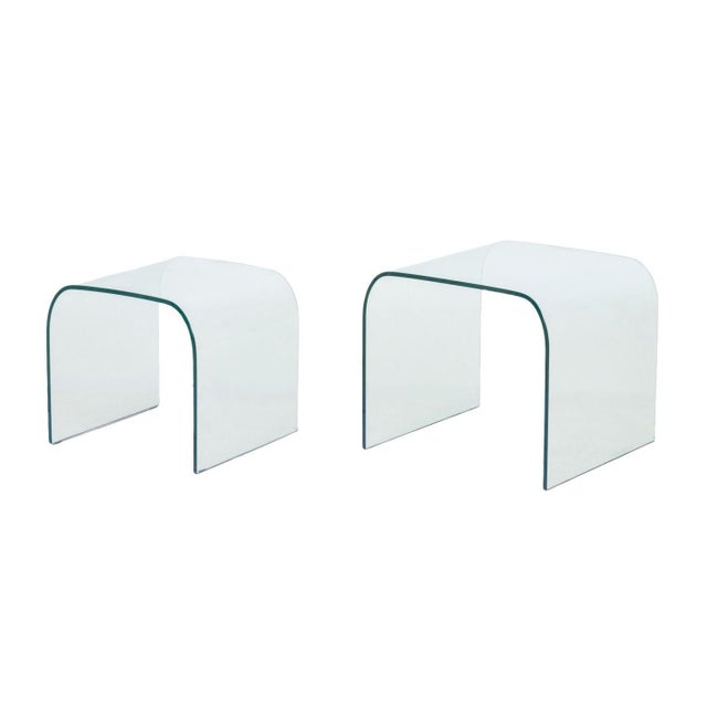 Set of Two Modern Waterfall Glass Nesting Side Tables. Larger: 16.25" H x 19" W x 17.75" D. Provenance: From a Warren, New...