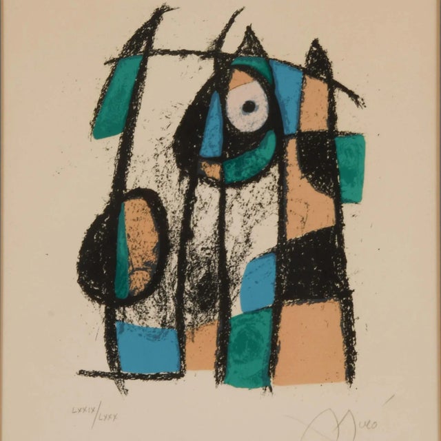 Own a rare and vibrant piece of modern art history with this signed limited-edition Joan Miró lithograph, titled...
