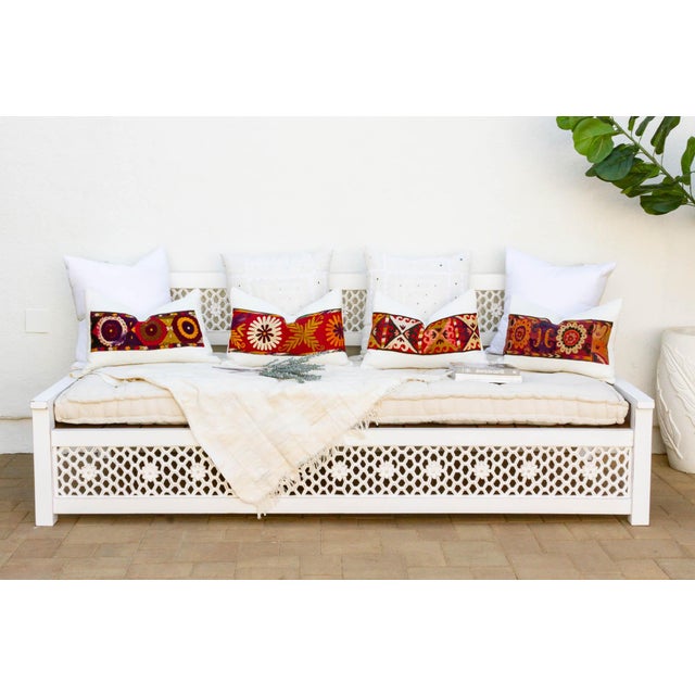 Inspired by ancient Moorish architecture, our custom Jali sofa daybed features a finely carved see-through floral panel...