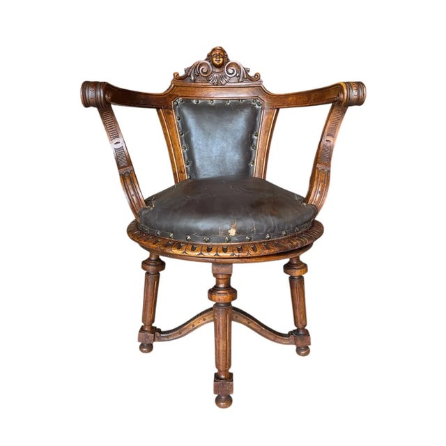 37"H x 27 1/2"W x 25"D Seat Height:19" Arm Height: 31" Seat: 20"Diam This 19th-century French swivel chair is a testament...