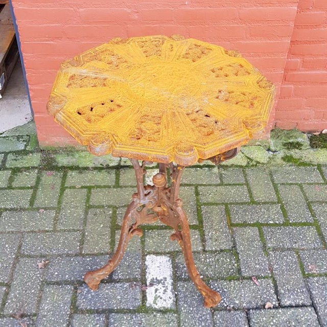 Solid cast iron garden table in Art Nouveau style.
