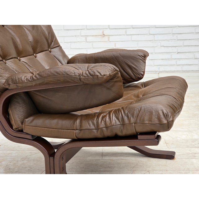 1970s, Scandinavian design. Armchair in brown furniture leather, canvas, beech bent wood. Original very good condition: no...