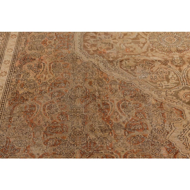 A late 19th century Indian Amritsar rug, with soft caramels, grays, peach and greens with an overall intricate floral...