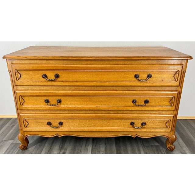 The chest of drawers sideboard has three drawers , the drawers are decorated with wonderful carvings, it rests on...