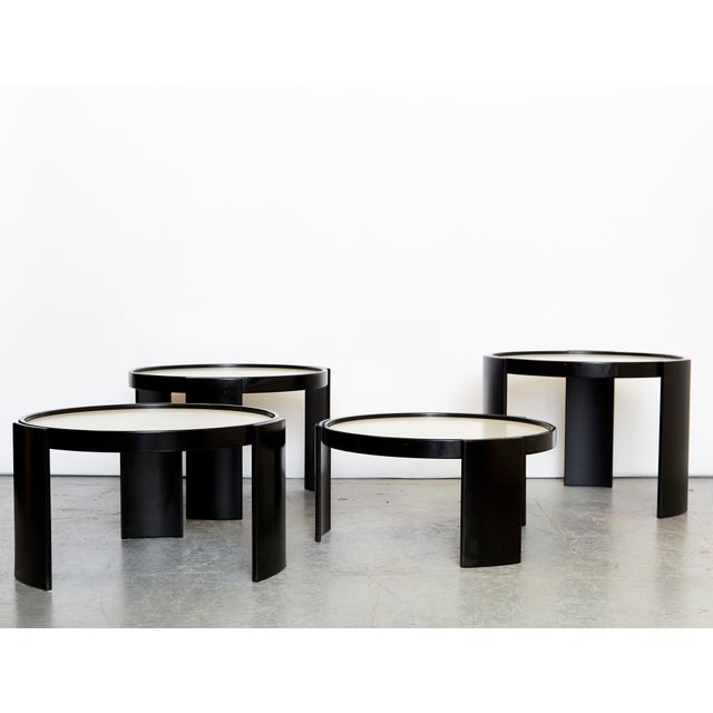 Condition: Good condition with minor scratches or chips. All four tables have reversible tabletops. Stackable. Gianfranco...