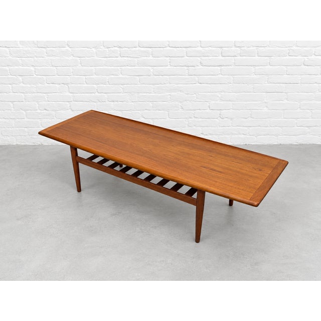 Mid Century Modern Coffee Table by Grete Jalk, C. 1960’s | Upturned Edges & Slatted Magazine Rack For Sale In New York - Image 6 of 13